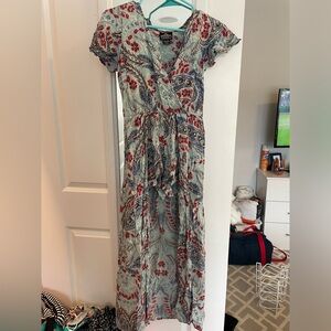 Beautiful patterned romper with flowy skirt. Size S.